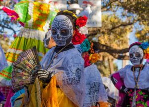 Group of People with Skull Masks Celebrating the Day of the Dead in Mexico | Luxury Mexico Holidays | The Ultimate Travel Company