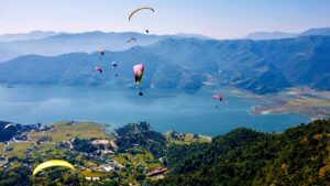 Pokhara, Nepal | Paragliders at Phewa Lake | Ultimate Travel Company