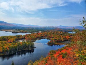 Aerial View of Mont-Tremblant National Park and Lake Monroe Surrounded by Autumn Foliage | Luxury Canada Holidays | The Ultimate Travel Company