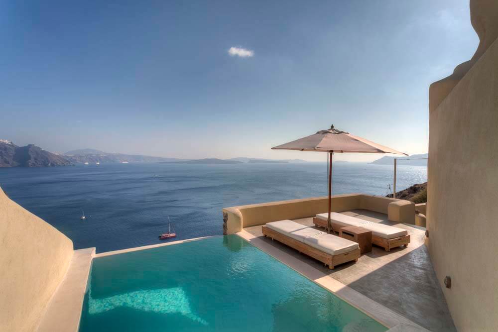 Mystique, Santorini | Greece | Cliffside pool with ocean view | The Ultimate Travel Company