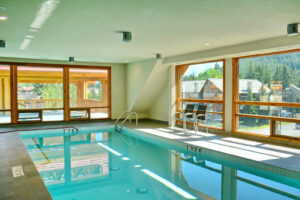 Moose Hotel And Suites, Banff | Hotel's indoor pool at daytime | The Ultimate Travel Company