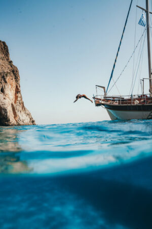 Blue Palace, Elounda, Crete | Greece | Woman swimming | The Ultimate Travel Company