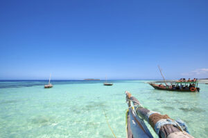 Boats in the Turquoise Waters of Zanzibar | Zanzibar Holidays | The Ultimate Travel Company