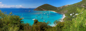 British Virgin Islands | Panoramic view of a tropical bay with turquoise waters and anchored sailboats | The Ultimate Travel Company