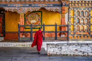 Monk at a Monastery in Bhutan | Luxury Bhutan Holidays | The Ultimate Travel Company