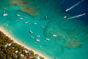 Aerial View of Boats on Clear Blue Water Near a Tropical Beach in the British Virgin Islands, the Caribbean | Luxury British Virgin Islands Holidays | The Ultimate Travel Company
