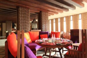 Ma’in Hot Springs, Jordan | Modern hotel room with wooden furnishings and mountain view | The Ultimate Travel Company