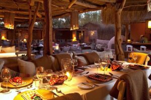 Awasi Atacama | Atacama Desert | Chile | An intimate dining setting with lit candles | The Ultimate Travel Company