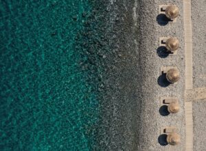 Blue Palace, Elounda, Crete | Greece | Aerial view of the beach | The Ultimate Travel Company