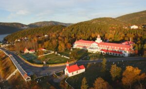 Aerial View of Hôtel Tadoussac with Surrounding Autumn Foliage | Luxury Canada Holidays | The Ultimate Travel Company