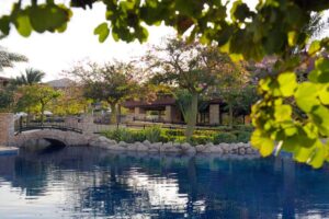 View of the Swimming Pool, Bridge and Accommodation at Movenpick Aqaba in Tala Bay | Jordan Holidays | The Ultimate Travel Company