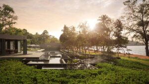 Koh Russey Villas & Resort | Cambodia | Sunrise over a resort pool by the beach | The Ultimate Travel Company