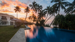 The Sun Setting Across the Swimming Pool at Kumu Beach | Sri Lanka Holidays | The Ultimate Travel Company