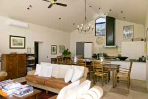 The Point Villas, Taupo | New Zealand | Open-plan living room with kitchen and dining area | The Ultimate Travel Company