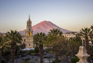 Cathedral and Plaza with a Volcano in the Background at Dusk | Luxury Peru Holidays | The Ultimate Travel Company