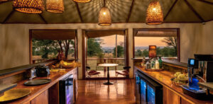 Bar Interior Leading Out Onto the Deck at Sayari Camp | Serengeti National Park | Tanzania Safaris | Luxury Holidays by The Ultimate Travel Company