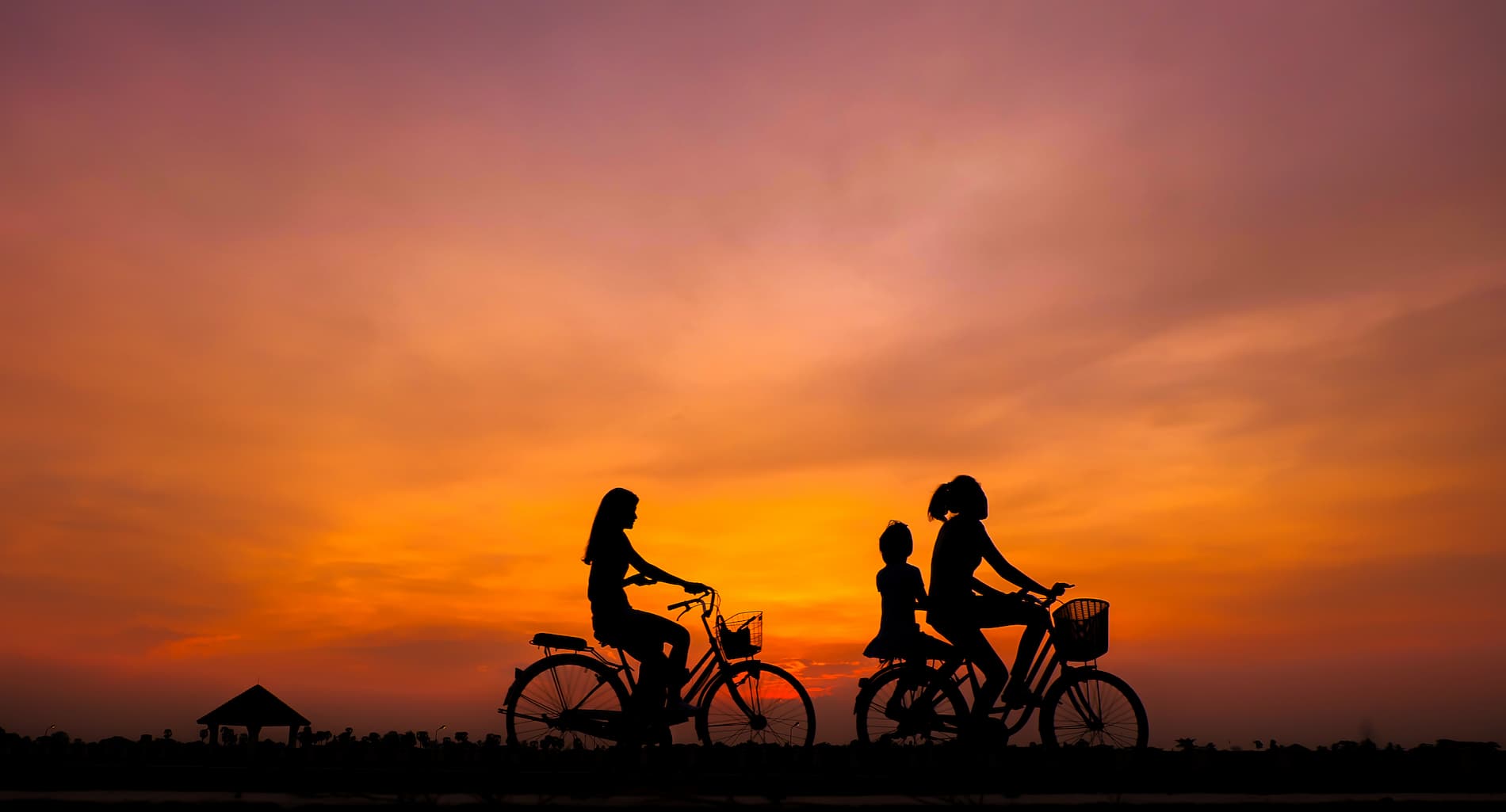Bike on landscape with sunrise | Tailor-Made Luxury Family Holidays | The Ultimate Travel Company