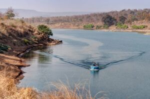 Boat Travelling Through the Waters in Northern India | India Holidays | The Ultimate Travel Company