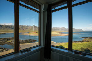 Hotel Budir, Snaefellsnes Peninsula | Iceland | Hotel Budir window with the overlooking lake| The Ultimate Travel Company