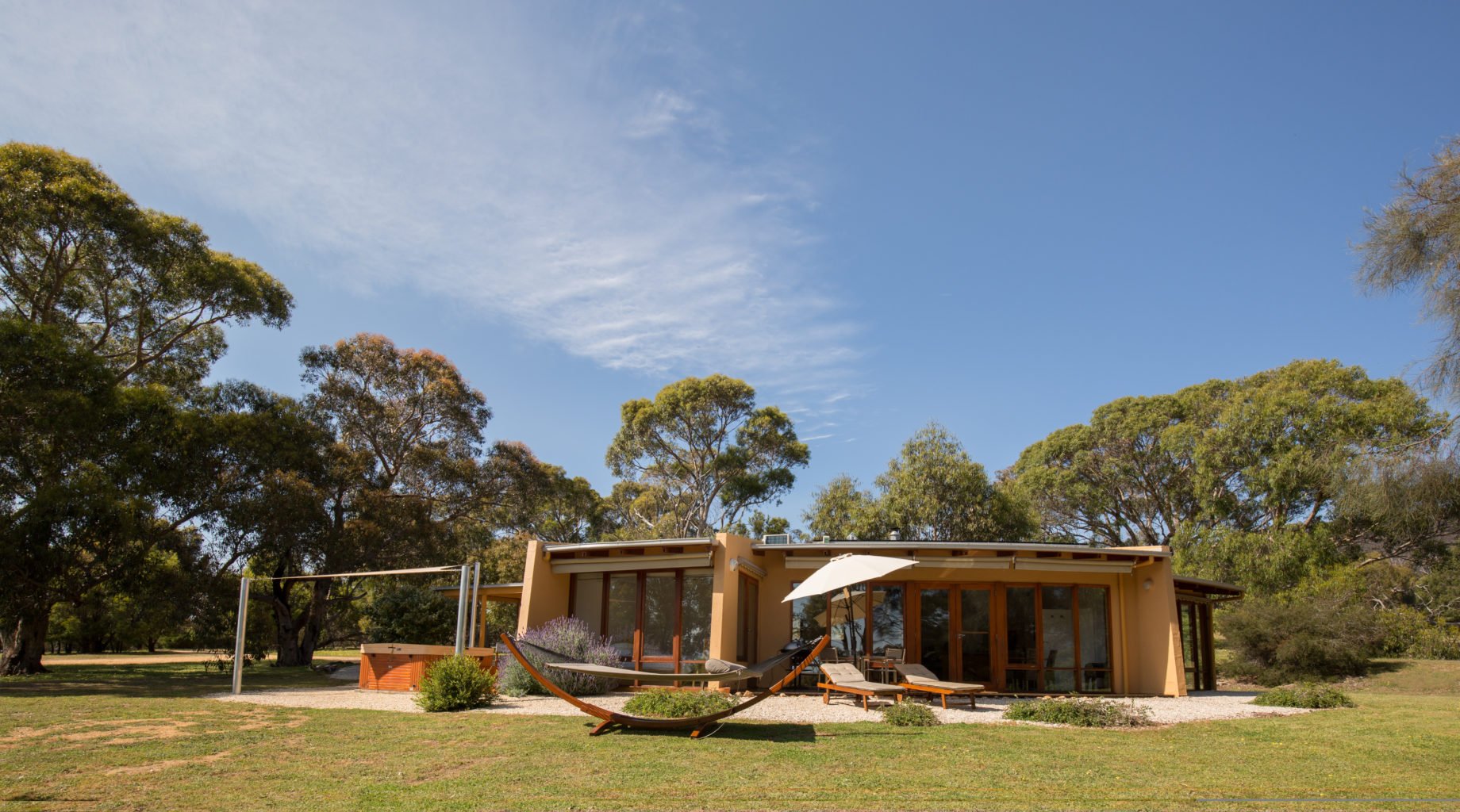 Boroka Downs, Grampians National Park | Australia | Exterior of a modern house with a hammock and trees | The Ultimate Travel Company