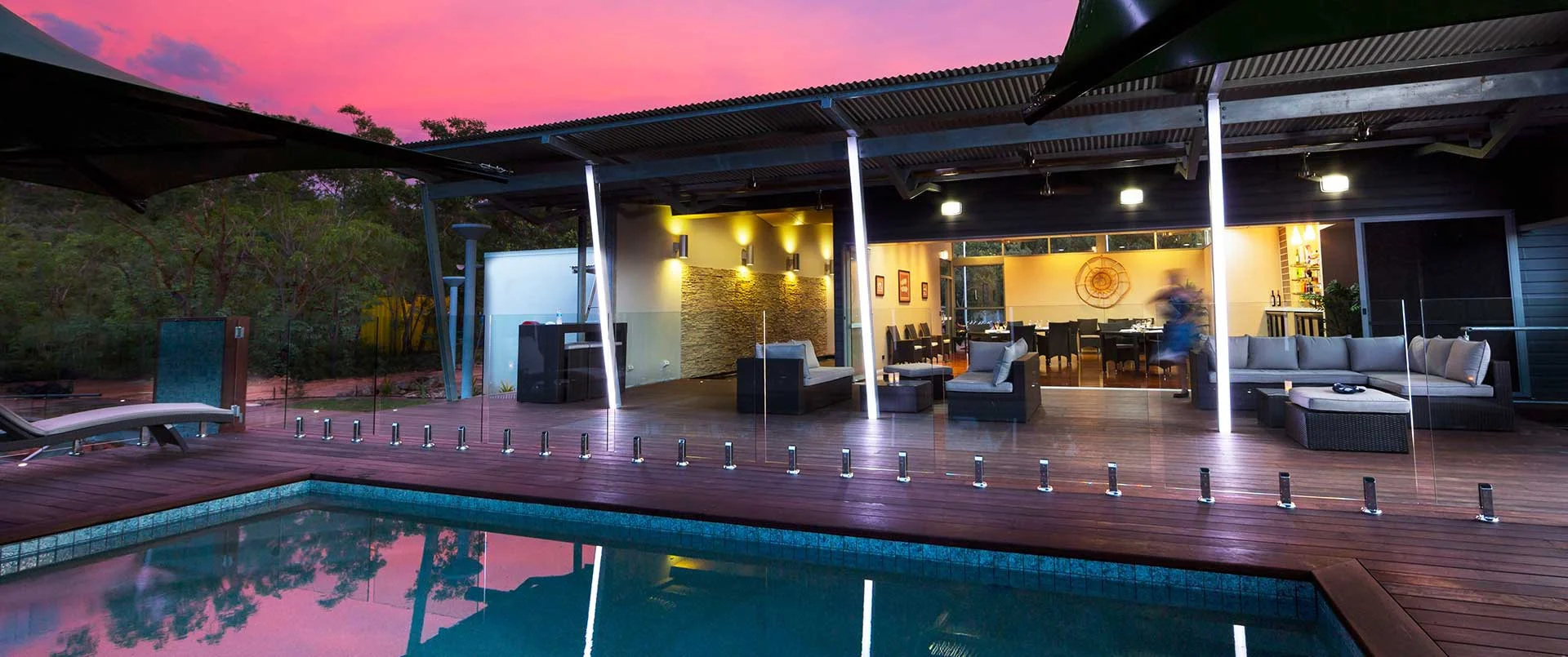 Cicada Lodge, Katherine | Australia | Outdoor pool and lounge area at dusk | The Ultimate Travel Company