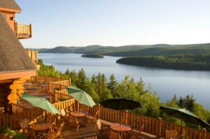 Hôtel Sacacomie, Laurentian Mountains | Canada | terrace and lake | The Ultimate Travel Company