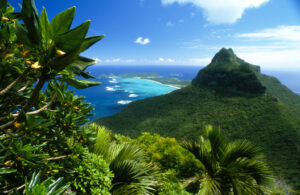 Capella Lodge, Lord Howe Island | Australia | Scenic view of a mountain peak and lush tropical foliage with ocean backdrop | The Ultimate Travel Company