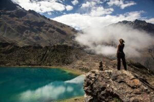 A Hiker Overlooking the Lake on the Salkantay Trek | Tailor-Made Peru Holidays | The Ultimate Travel Company