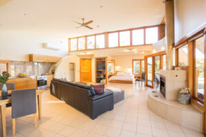 Boroka Downs, Grampians National Park | Australia | A bright living room with a sofa and fireplace | The Ultimate Travel Company