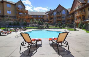 Stoneridge Mountain Resort, Canmore | Canada | Stoneridge exterior and pool | The Ultimate Travel Company