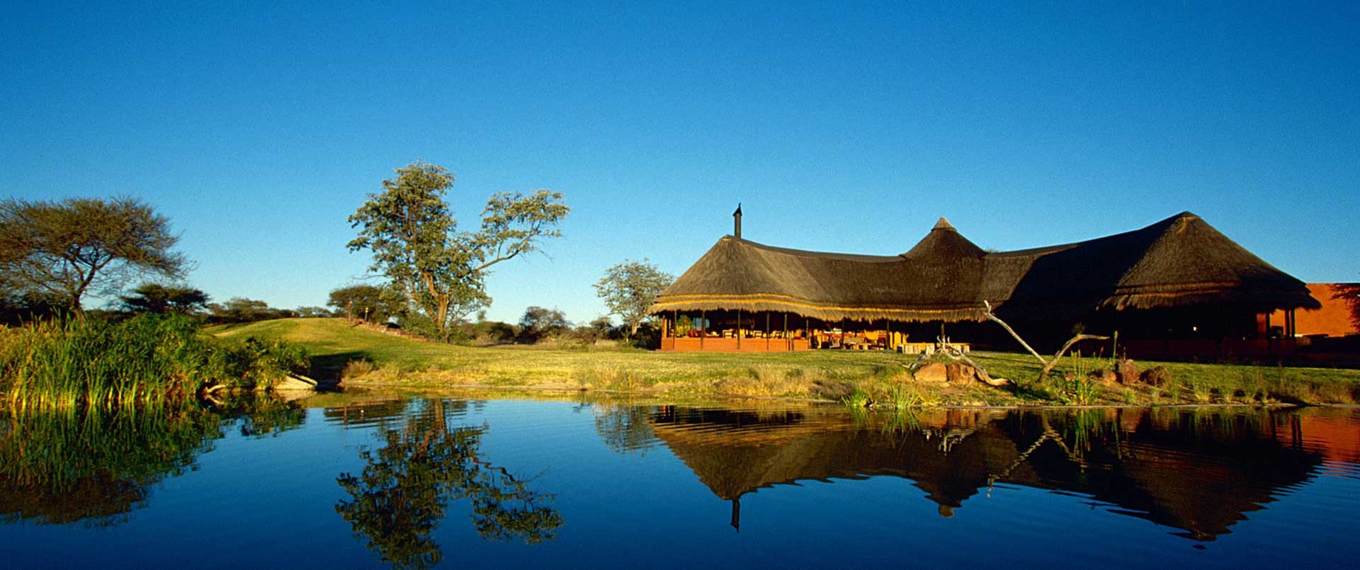 Okonjima Bush Camp, Central Highlands | Namibia | pond | The Ultimate Travel Company