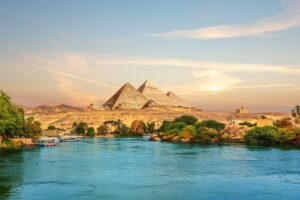 View on the Nile of the Great Pyramids and Boats | Egypt Holidays and Tours | The Ultimate Travel Company