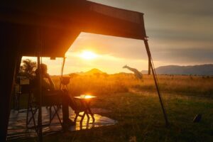 Woman Resting After African Safari in Luxury Tent in Sunset | Tanzania | The Ultimate Travel Company