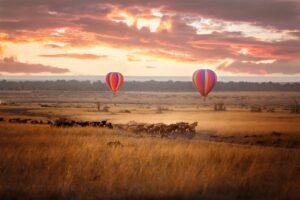 Sunrise over the Maasai Mara with Low-Flying Hot Air Balloons to See the Great Migration of Wildebeest | Best Holiday Destinations 2025 | Kenya Safari Holidays | The Ultimate Travel Company