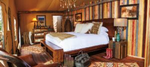 Bedroom in the Glamping Tents at North Bank Camp at Paws Up Ranch and Resort in Montana | Luxury Ranch Holidays in the USA | The Ultimate Travel Company