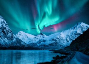 Northern,Lights,Over,The,Snowy,Mountains,,Frozen,Sea,,Reflection,In