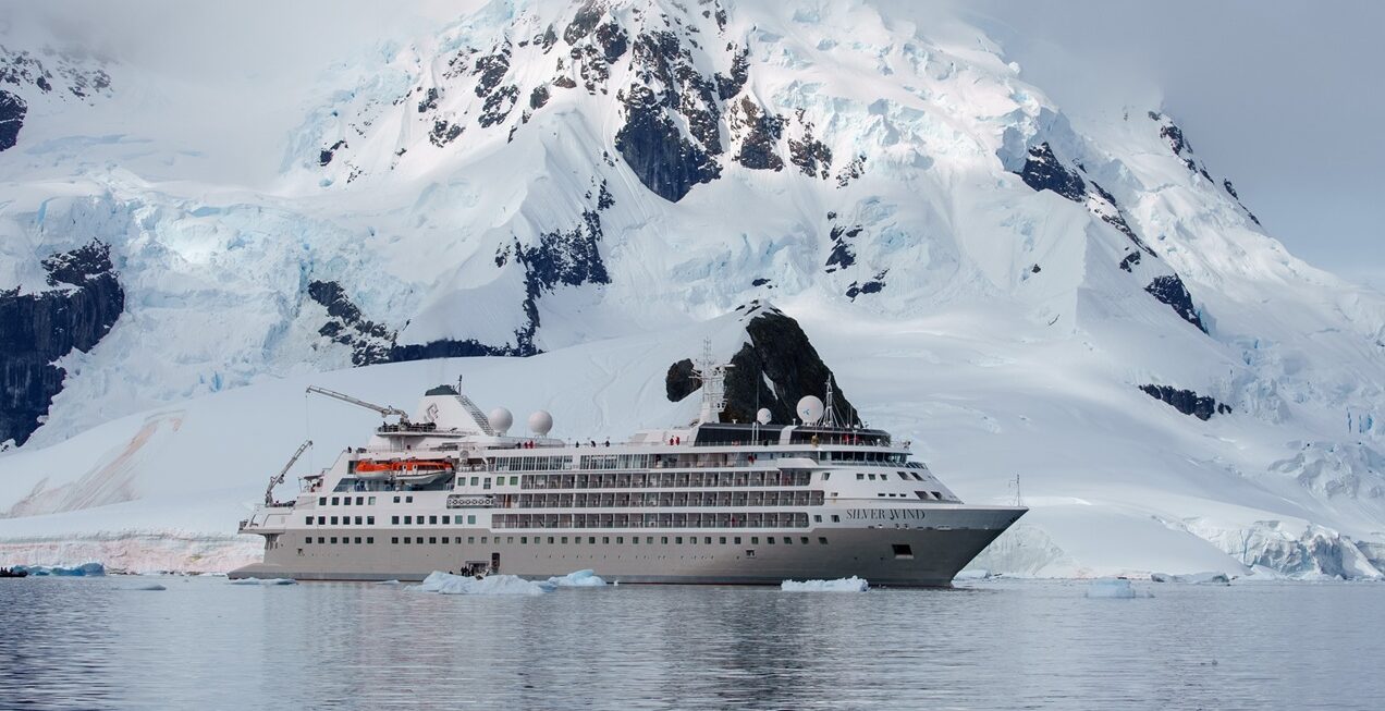 The Silver Wind by Silversea Surrounded by Snowy Mountains and Glaciers | Luxury Antarctica Cruises & Holidays | The Ultimate Travel Company