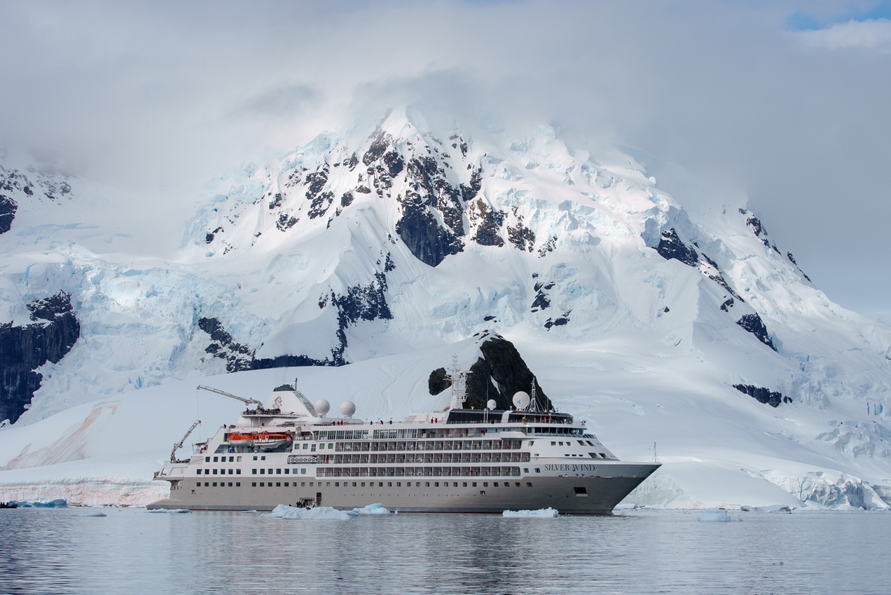 The Silver Wind by Silversea Surrounded by Snowy Mountains and Glaciers | Luxury Antarctica Cruises & Holidays | The Ultimate Travel Company