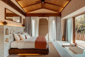 Bedroom in a Nipa Pool Villa at Namia River Retreat in Hoi An | Luxury Vietnam Holidays | The Ultimate Travel Company