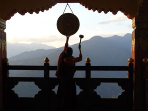A Little Monk Ringing A Gong In Paro | Luxury and Tailor-Made Holidays, Safaris & Tours 2025, 2026, 2027 | The Ultimate Travel Company