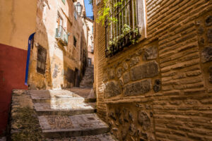 Medieval,Cobbled,And,Stepped,Street,With,Flowery,Balconies,And,Public